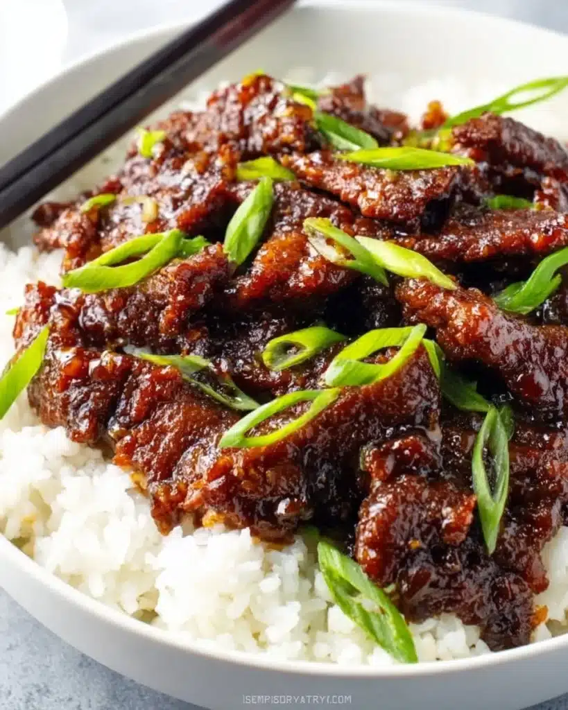 Gluten-free Mongolian beef dish served in a bowl with vegetables